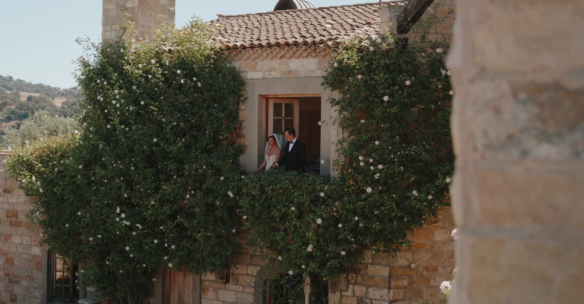A couple at golden hour, a still from a Rayne wedding film